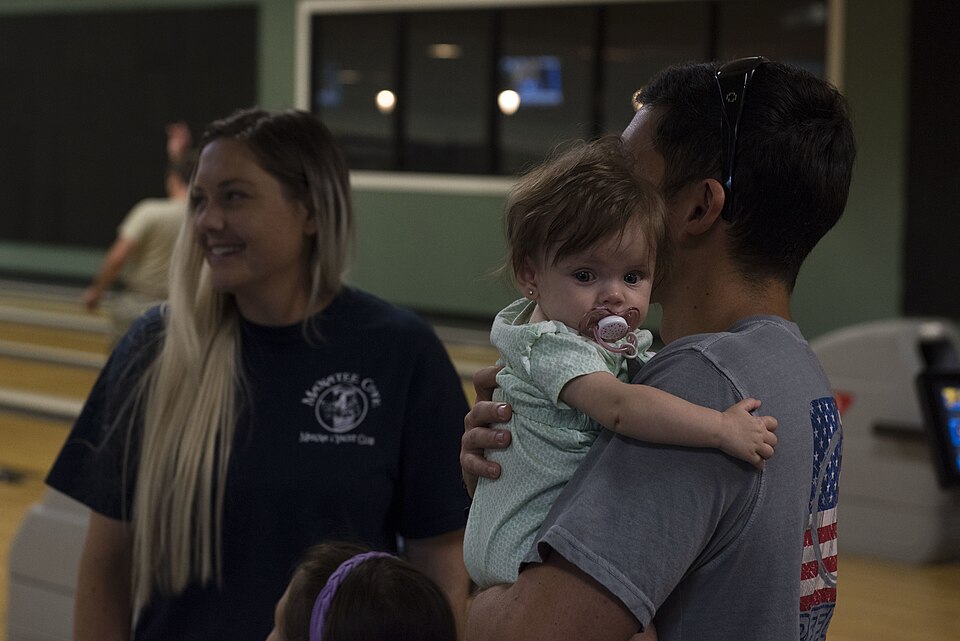 1st Lt. Adam Kriete, 337th Air Control Squadron student, and his family, bowl after arriving to Patrick Air Force Base from Tyndall Air Force Base, Fla. Oct…